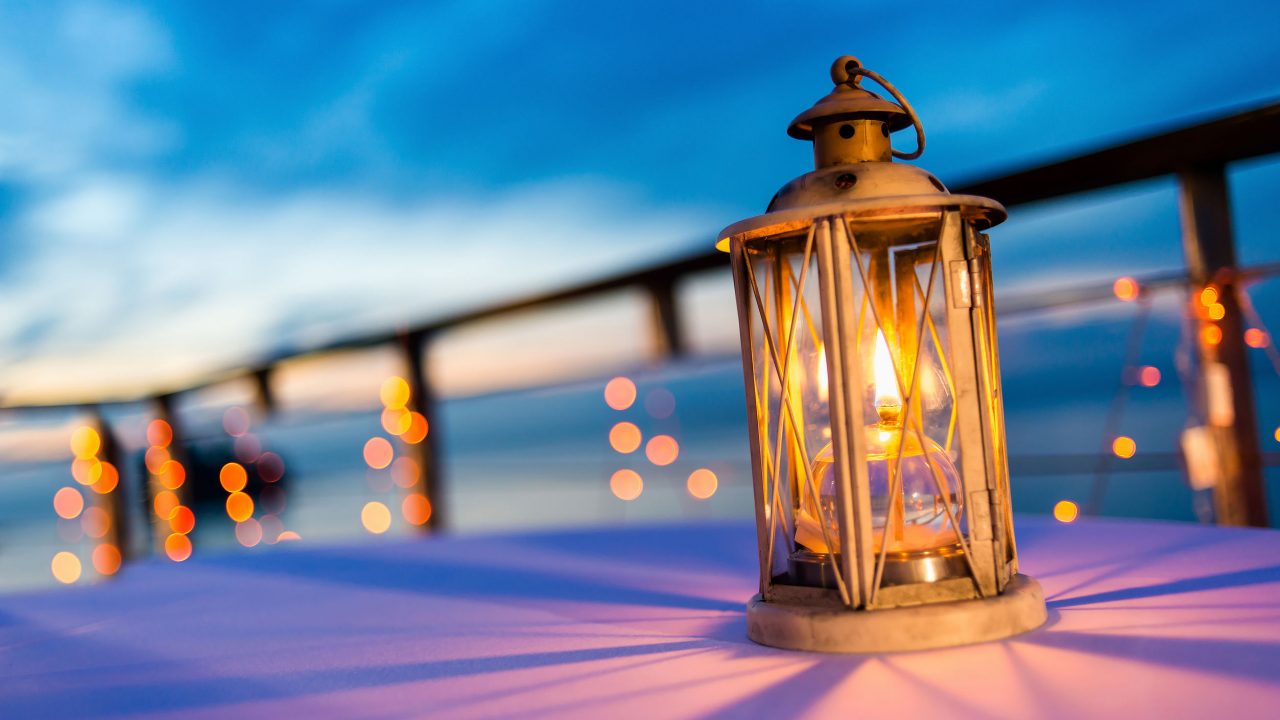 Lantern on table at twilight sky, selective focus.
